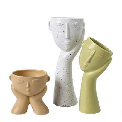 Contemporary Ceramic Vase Featuring Abstract Human Face Design